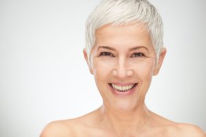 older woman smiling grey hair